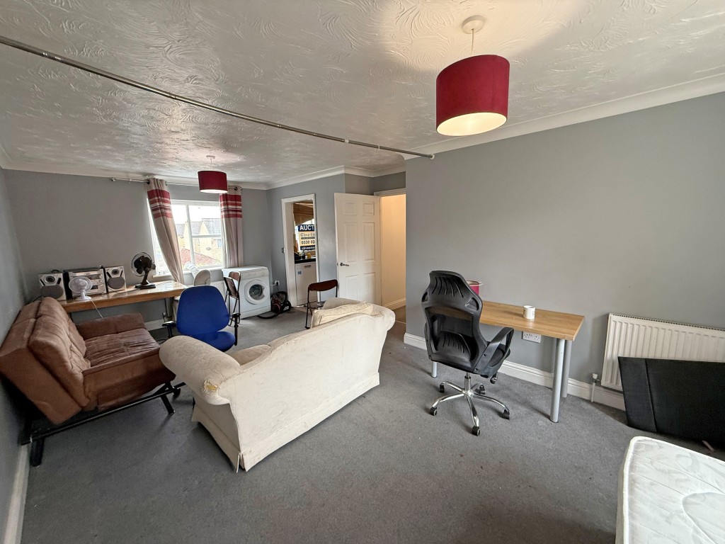 Lot: 36 - TWO-BEDROOM FIRST FLOOR FLAT FOR IMPROVEMENT - Second view of lounge/dining room with carpet and window